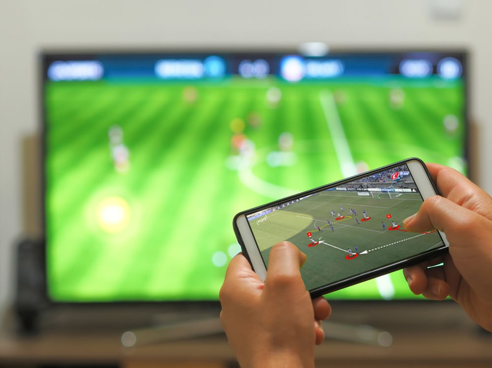 Playing soccer on a TV with a smartphone